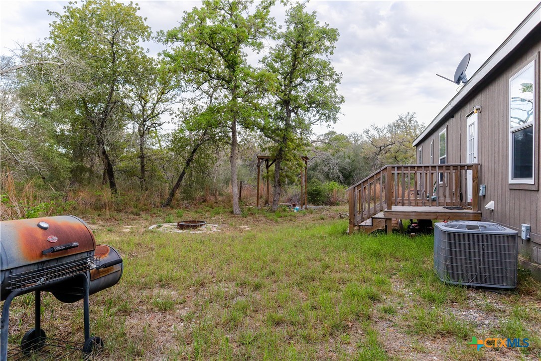 293 Turkey Tree Trail Seguin, TX 78155 - Photo 3 of 9 a backyard of a house with table and chairs