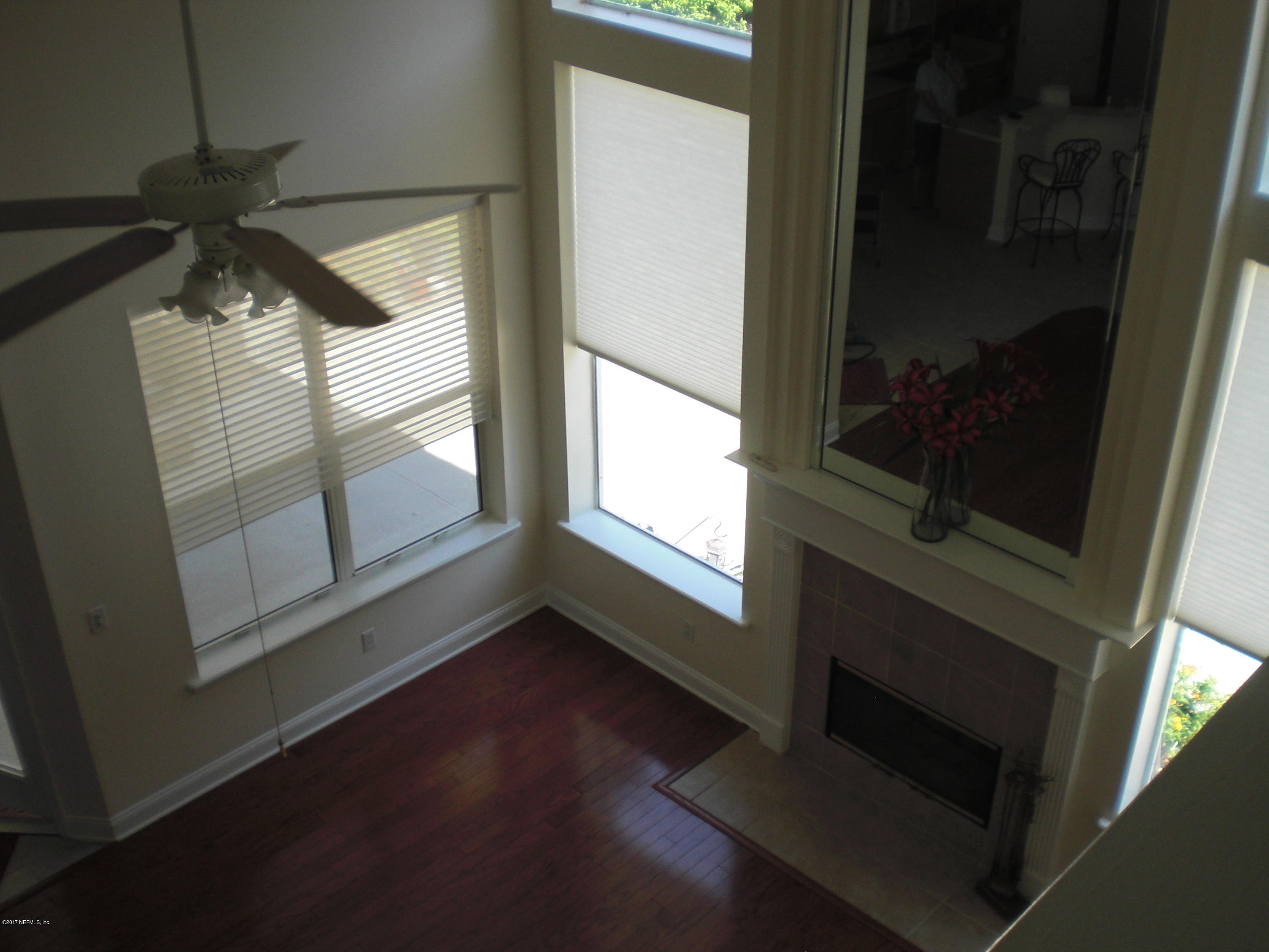 632 Pelham Road St. Augustine, FL 32092 - Photo 7 of 24 a view of a hallway with wooden floor and a window