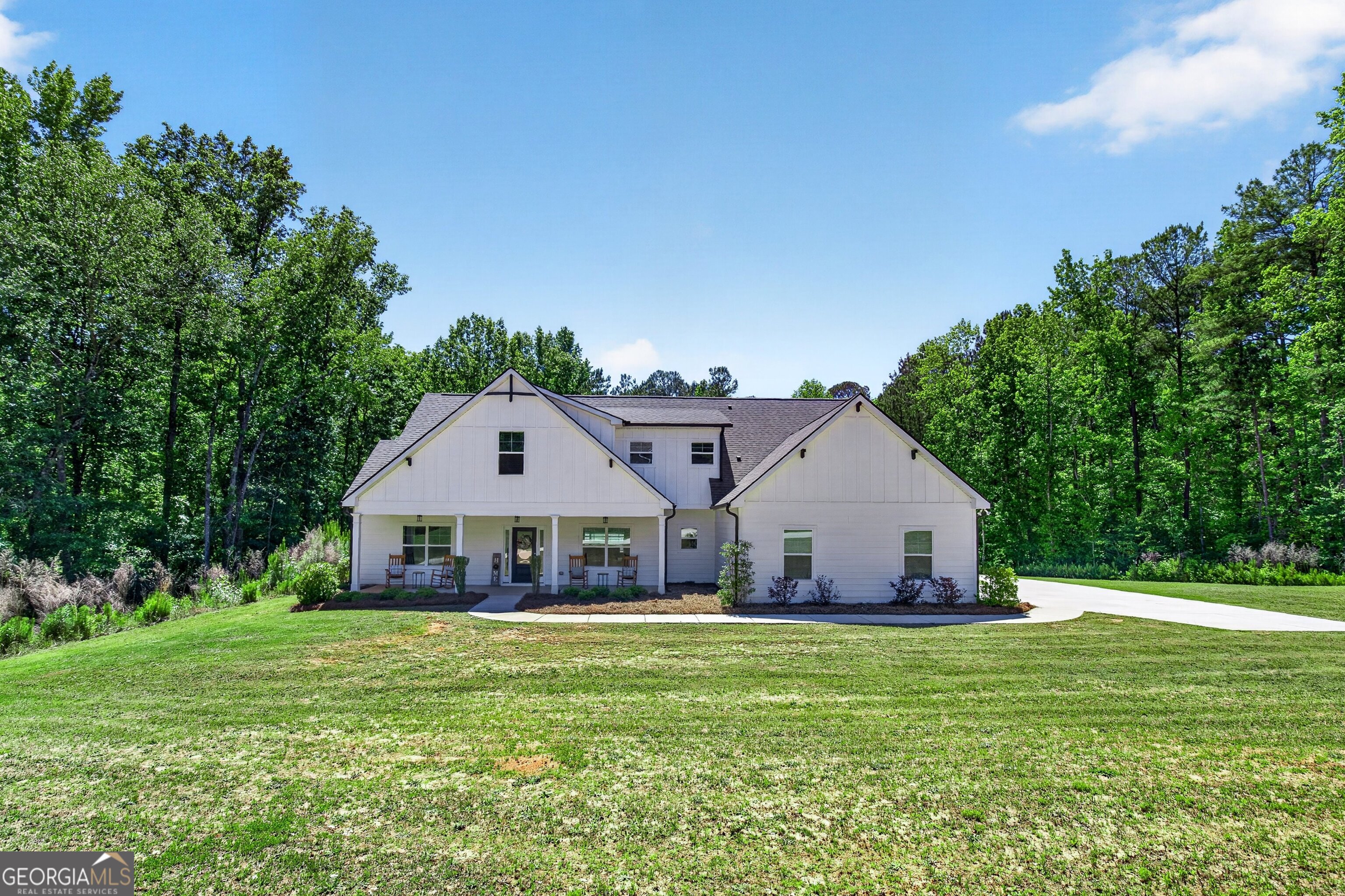 1764 Luther Bailey Road Senoia, GA 30276 - Photo 6 of 63 a front view of a house with a yard