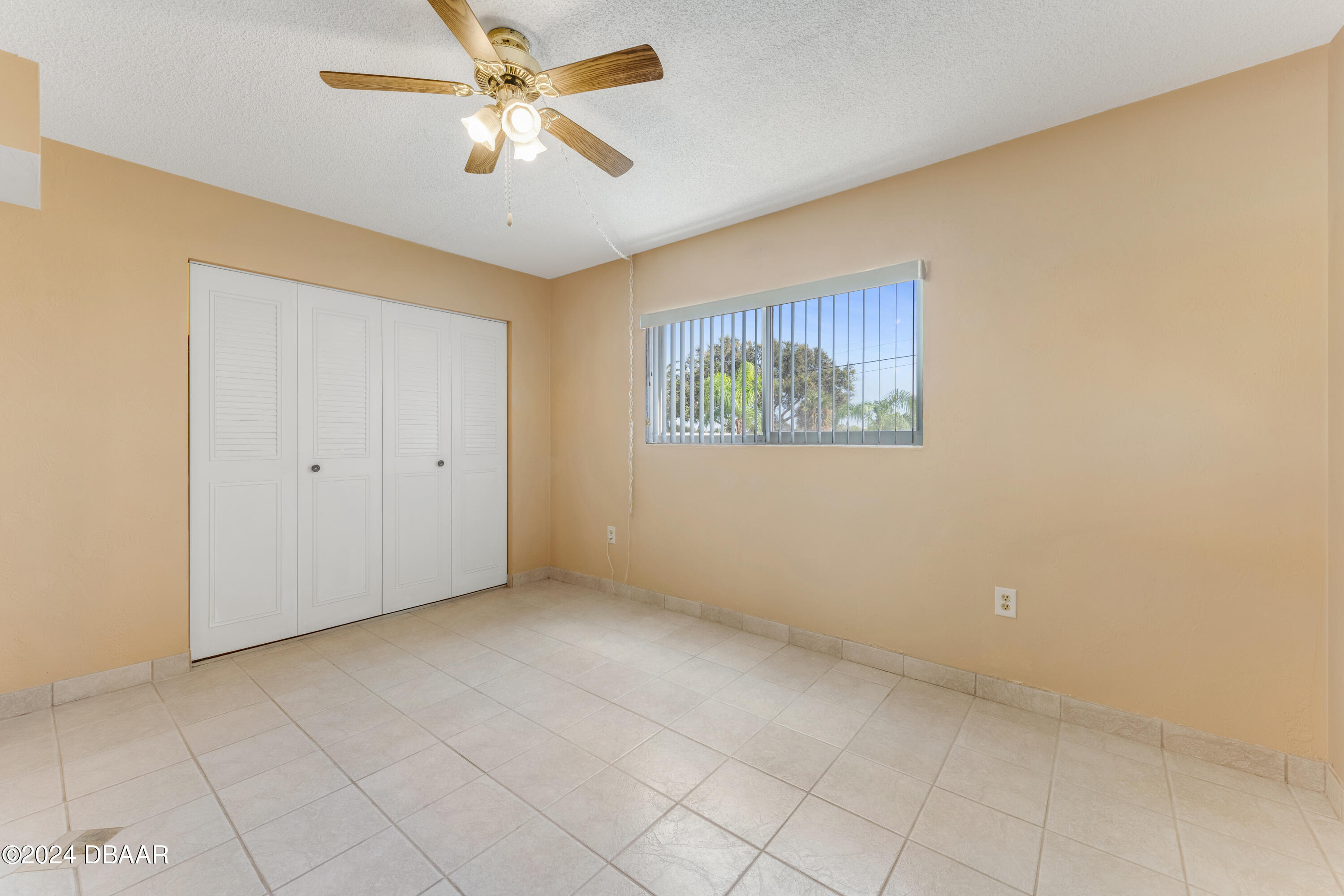 2711 North Halifax Avenue, Unit 282 Daytona Beach, FL 32118 - Photo 9 of 18 a view of an empty room with a window