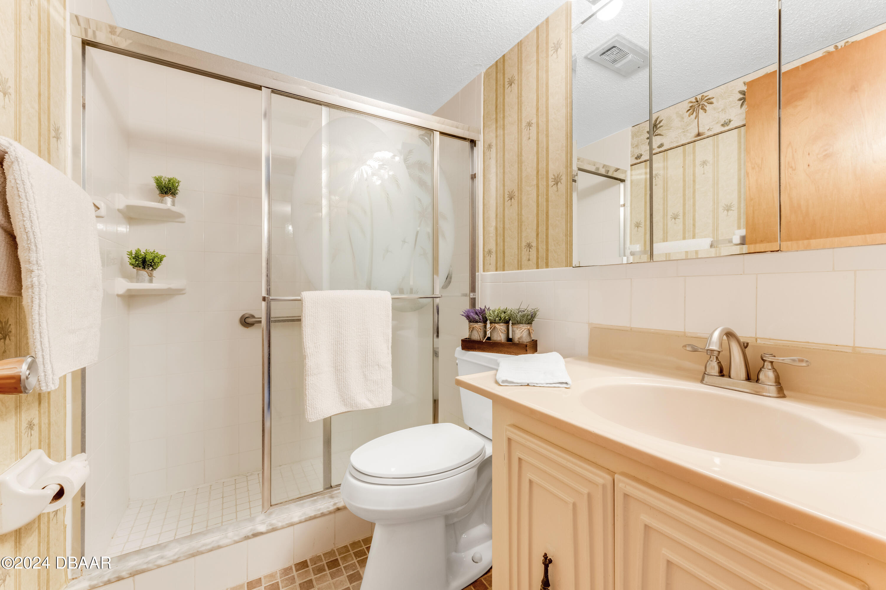 2711 North Halifax Avenue, Unit 282 Daytona Beach, FL 32118 - Photo 10 of 18 a bathroom with a sink a toilet and shower