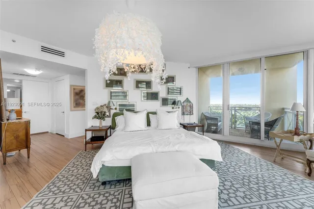 a bed room with a bed and a chair