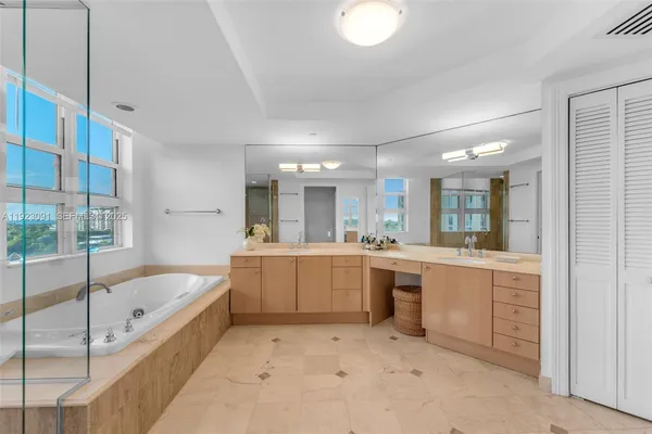 a spacious bathroom with a bathtub and a shower