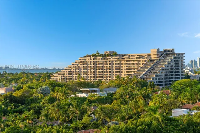 a view of living room with furniture and a potted plant