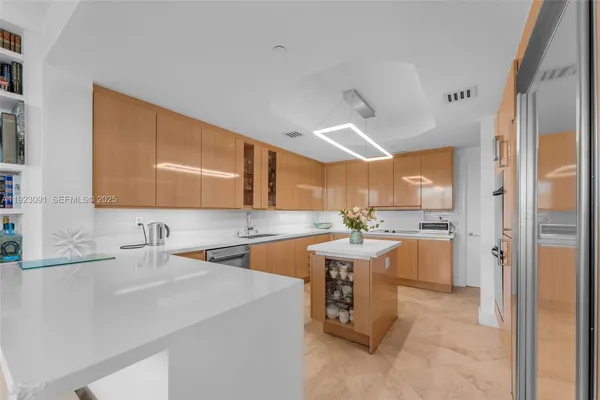 a kitchen with a sink and a refrigerator