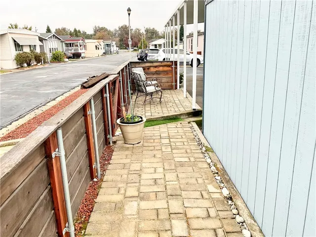 a balcony with view of car parked