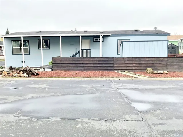 a view of house with backyard