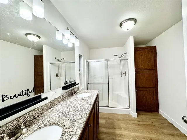 a bathroom with a granite countertop sink mirror and vanity