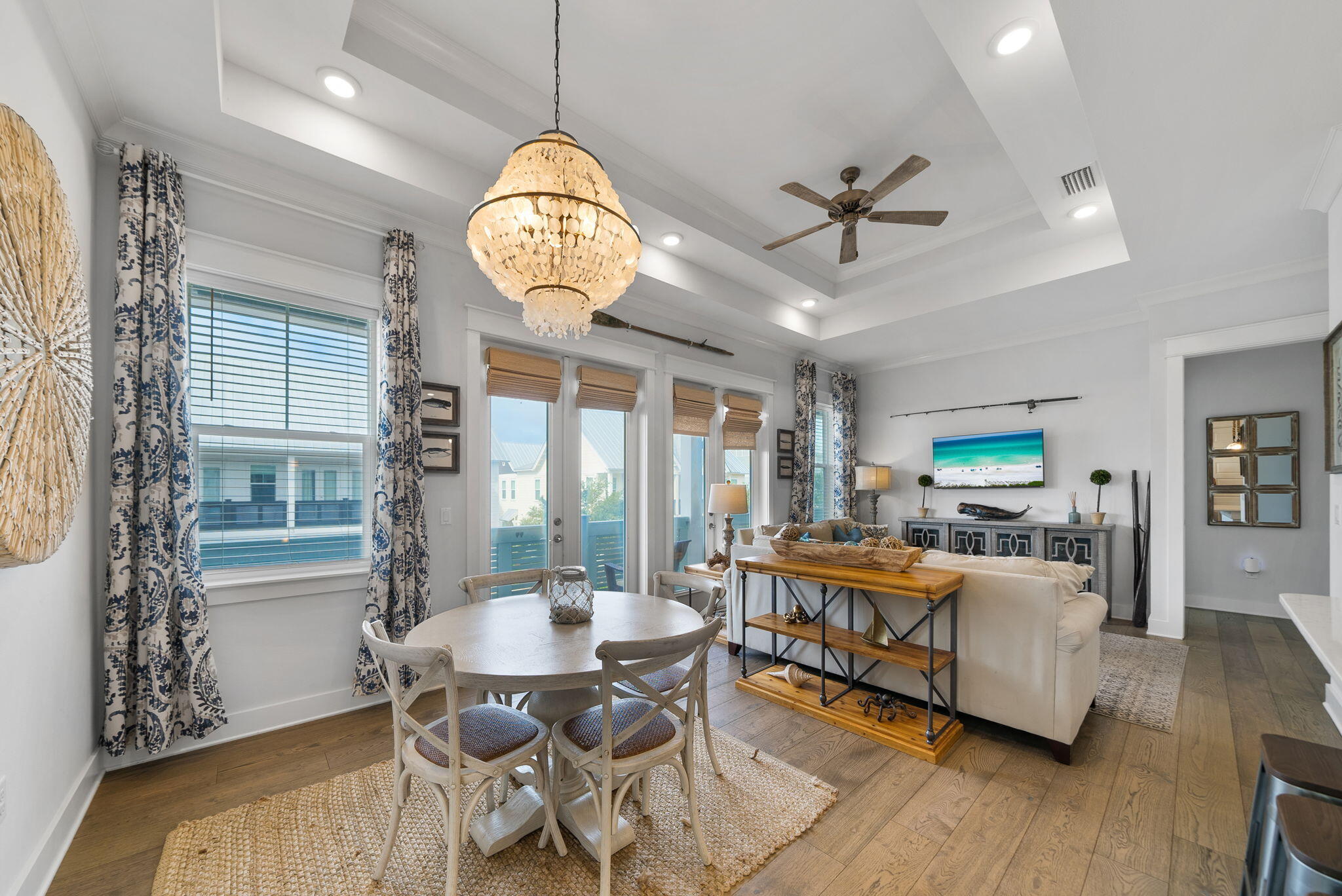 a view of a dining room with furniture wooden floor and chandelier