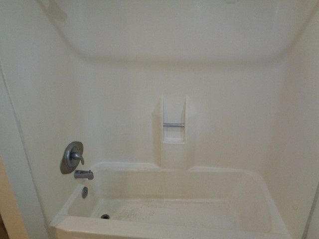 701 Foster Drive, Unit 4 Conroe, TX 77301 - Photo 11 of 11 a close up of a bathtub