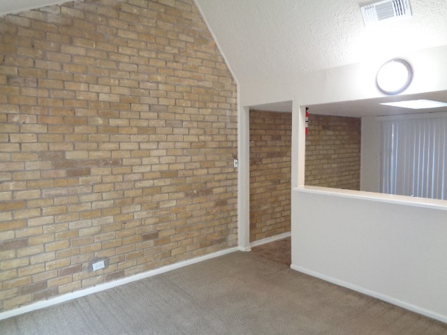 701 Foster Drive, Unit 4 Conroe, TX 77301 - Photo 3 of 11 a view of a livingroom with wooden floor and window