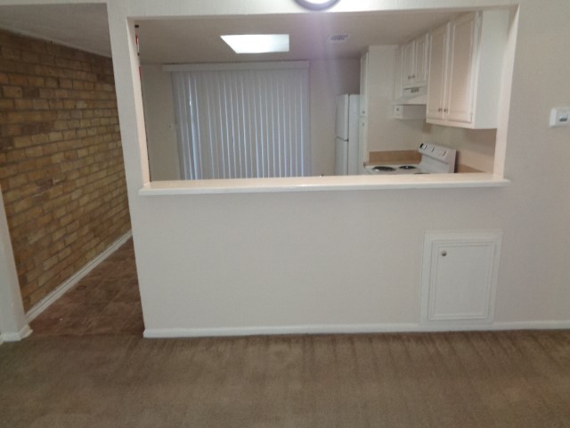 701 Foster Drive, Unit 4 Conroe, TX 77301 - Photo 4 of 11 a view of kitchen with wooden floor