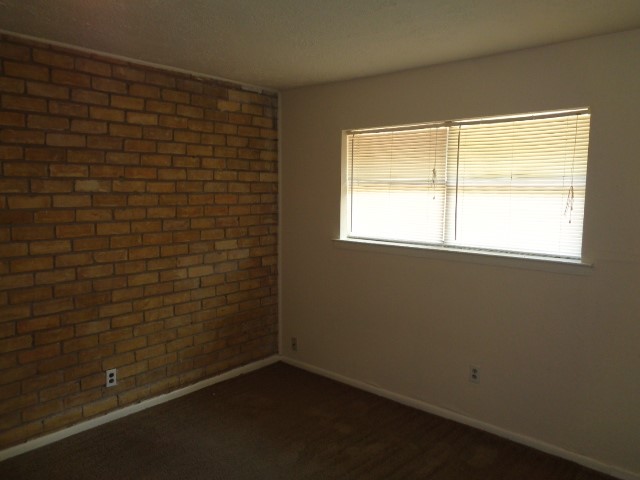 701 Foster Drive, Unit 4 Conroe, TX 77301 - Photo 7 of 11 a view of a small space with a window