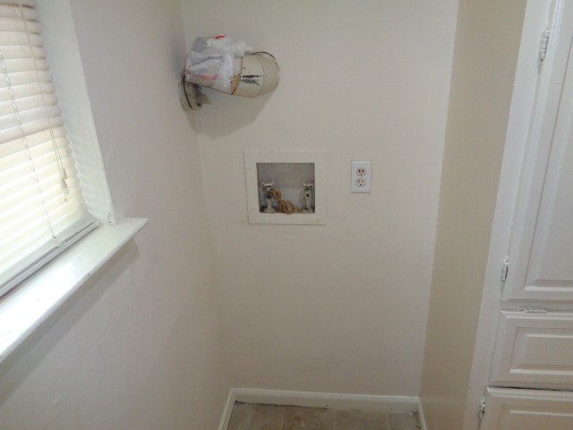 701 Foster Drive, Unit 4 Conroe, TX 77301 - Photo 10 of 11 a view of a hallway with a window