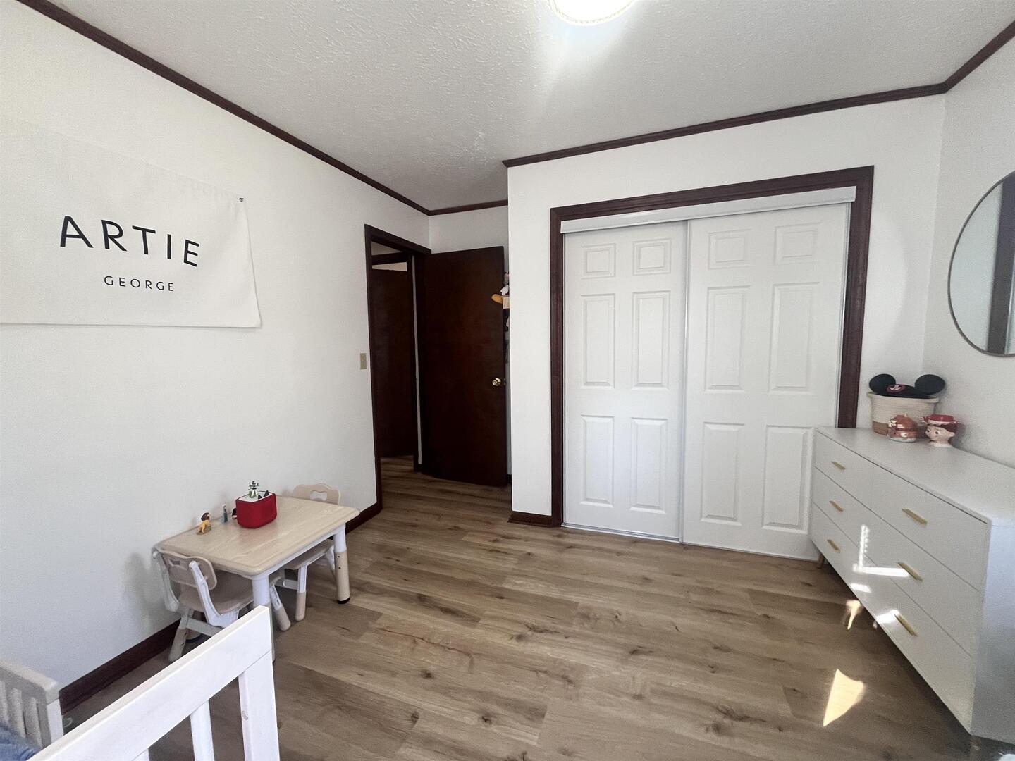 212 East 19th Street Metropolis, IL 62960 - Photo 23 of 30 a room with furniture and wooden floor