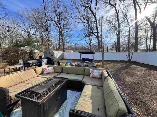 a view of outdoor sitting area with furniture