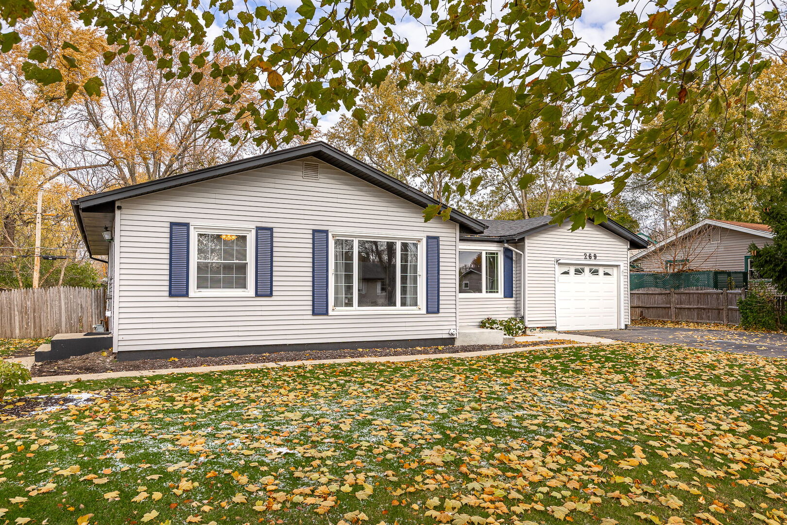 a house with trees in the background