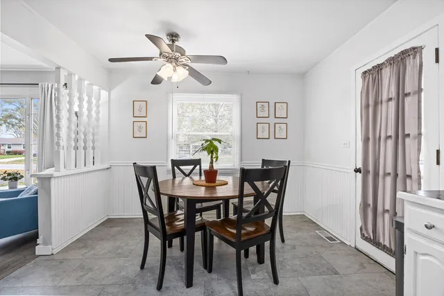 a dining room with furniture and window
