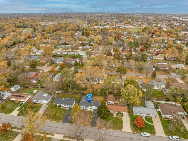 an aerial view of residential building with parking space