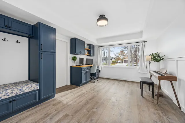 a view of a kitchen with furniture wooden floor and window