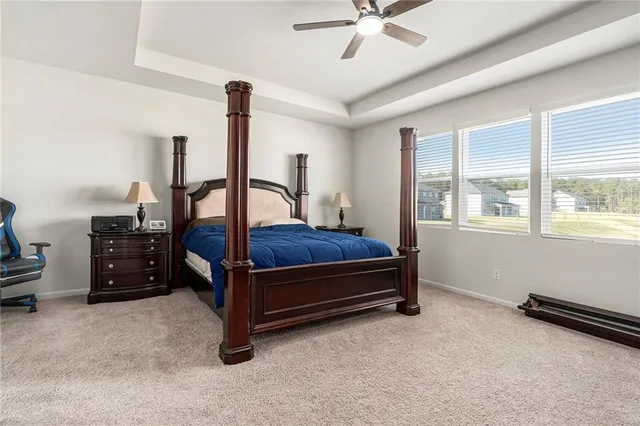 a bedroom with furniture and window