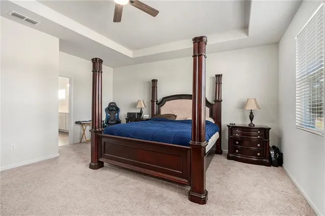 a bedroom with furniture and a window