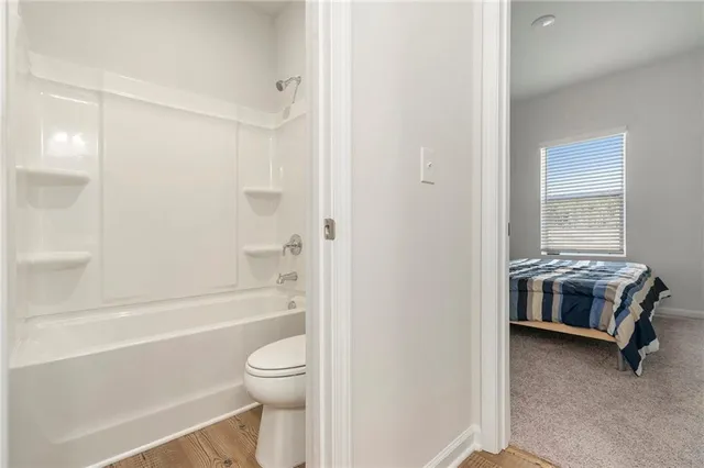 a bathroom with a toilet a sink and a bathtub