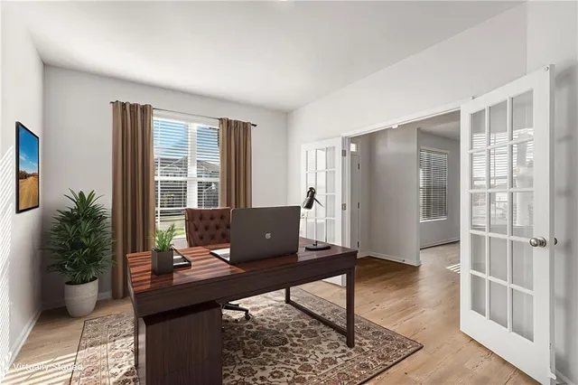 a view of a workspace with furniture