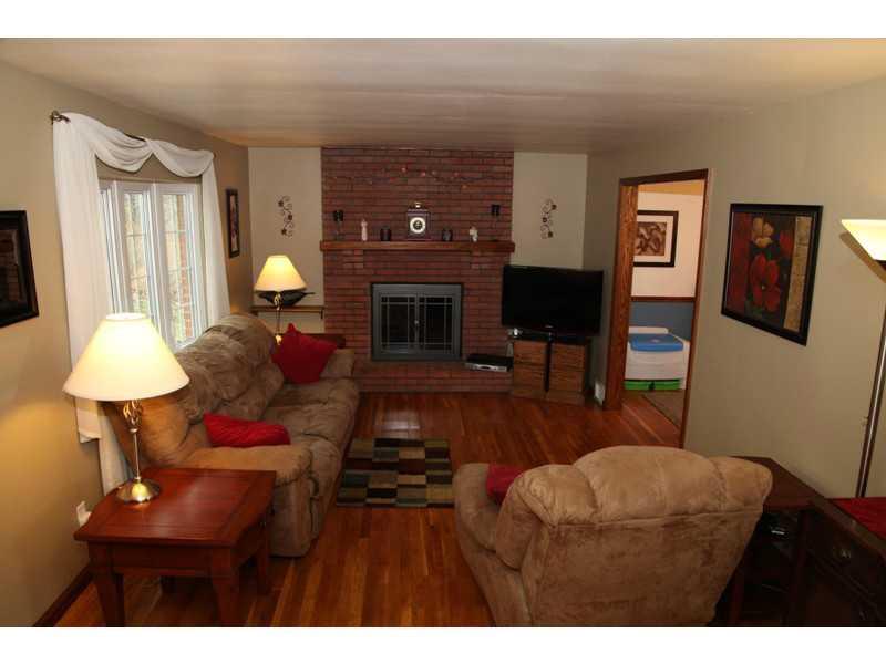 113 Deimling Road Pittsburgh, PA 15229 - Photo 2 of 16 Living Room. The Front Window is Updated and Lovely, Brick Hearth "Gas Log" Fireplace