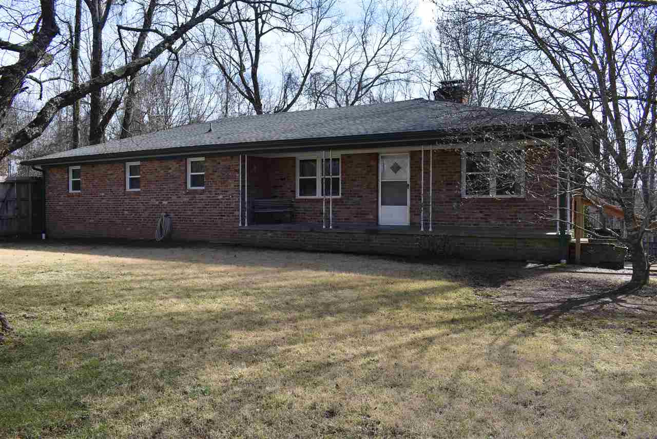 1516 Mifflin Road Jackson, TN 38301 - Photo 1 of 1 a house that has a tree in front of it
