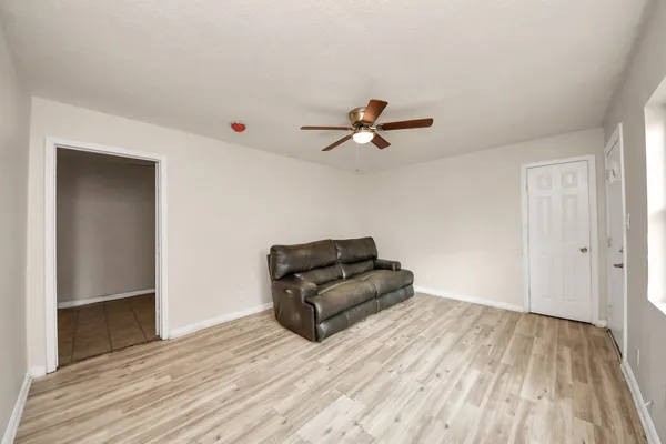 a living room with a bed and furniture