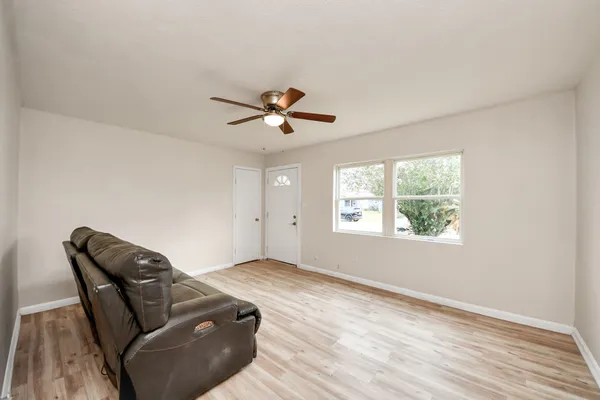 a living room with furniture and a window