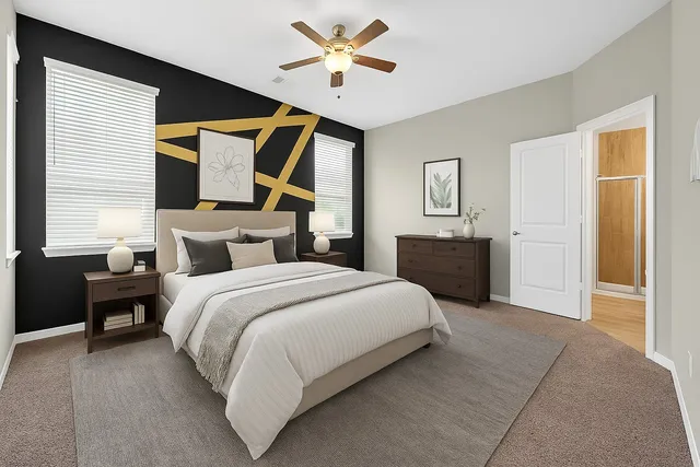 a bathroom with a tub sink shower and mirror