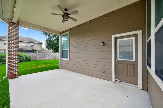 a view of yard with swimming pool and green space