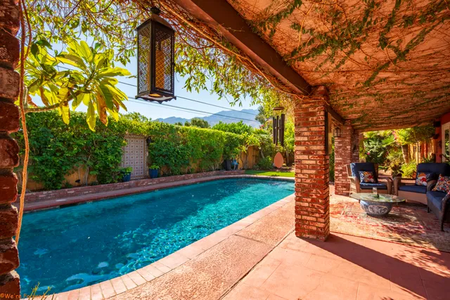 a kitchen with stainless steel appliances granite countertop white cabinets and a stove