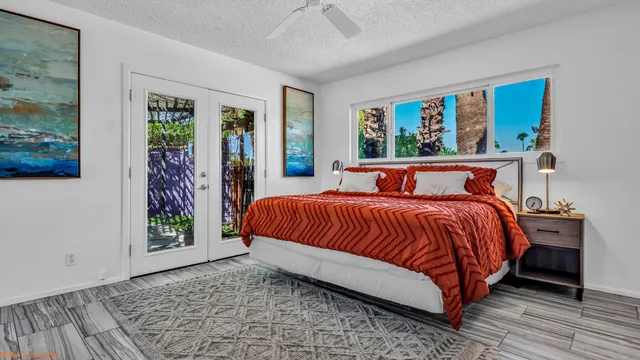 a view of a chairs and table in a backyard