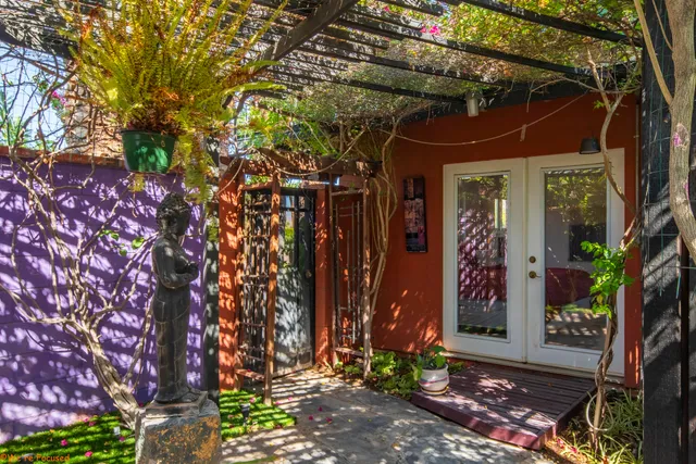 a bedroom with a large bed and a large window