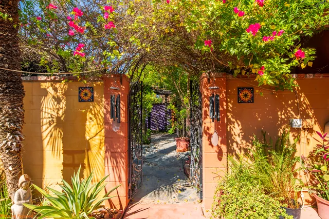 a view of a house with swimming pool patio and a yard