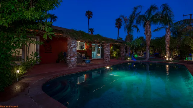 a backyard of a house with a tree