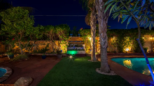 a view of a table and chairs in the garden