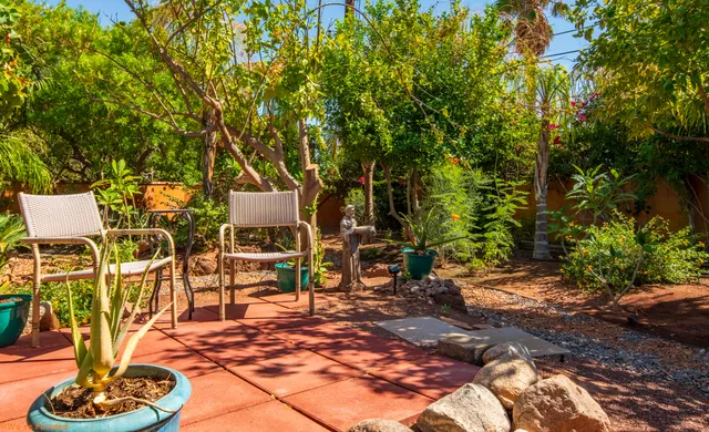 a view of a swimming pool with an outdoor space and seating area