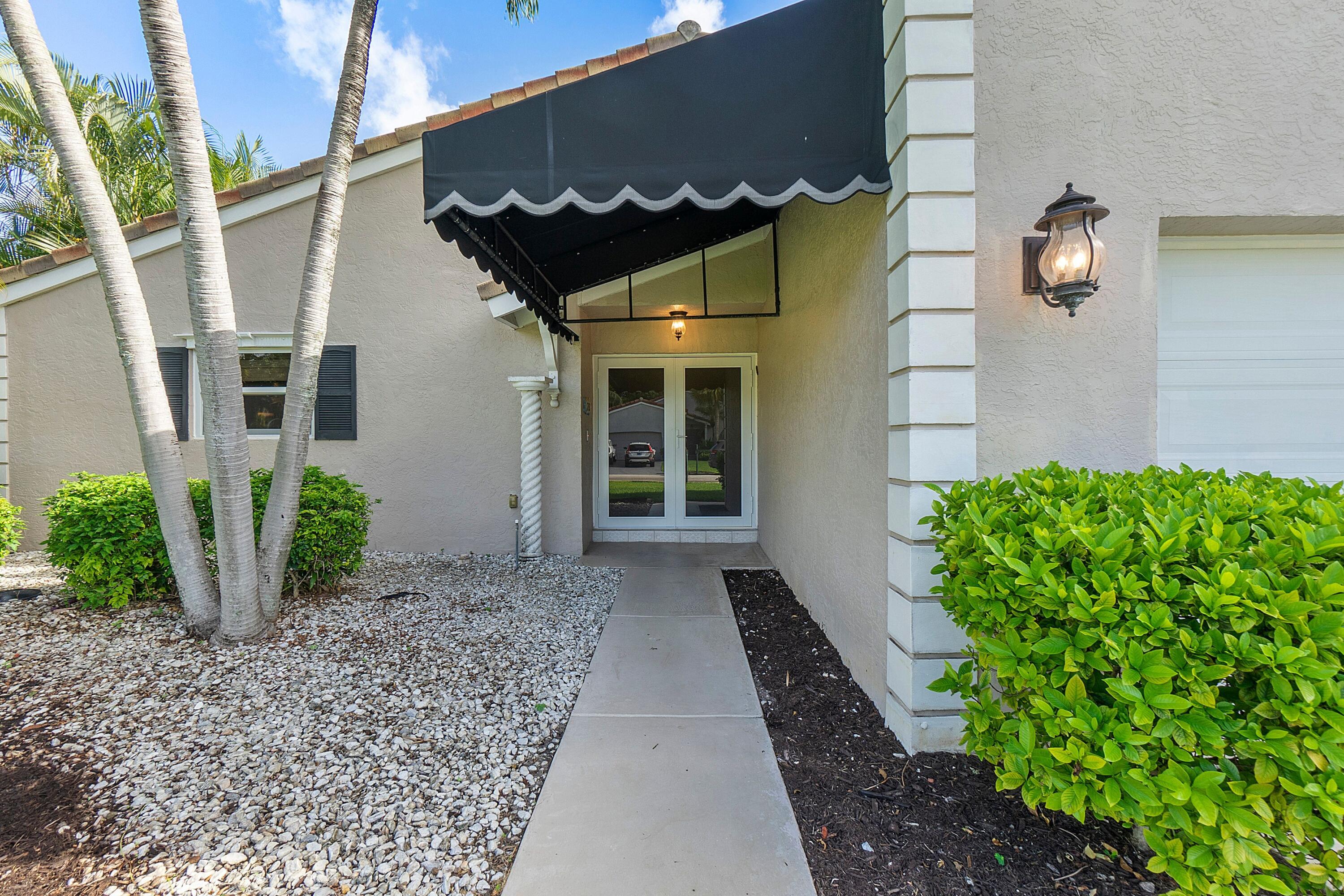 275 Northwest 69th Street Boca Raton, FL 33487 - Photo 11 of 34 boca lake front walk way