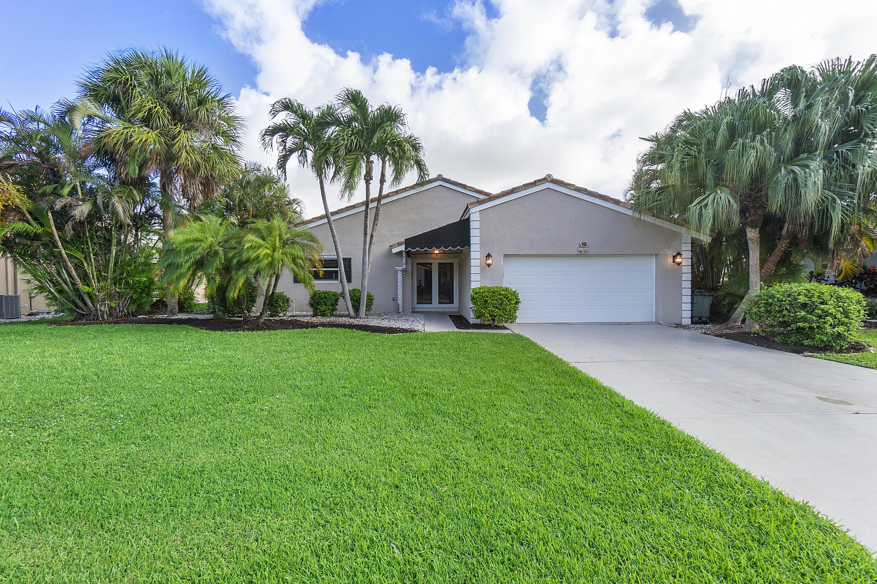 275 Northwest 69th Street Boca Raton, FL 33487 - Photo 31 of 34 BOCA LAKE FRONT OF HOUSE