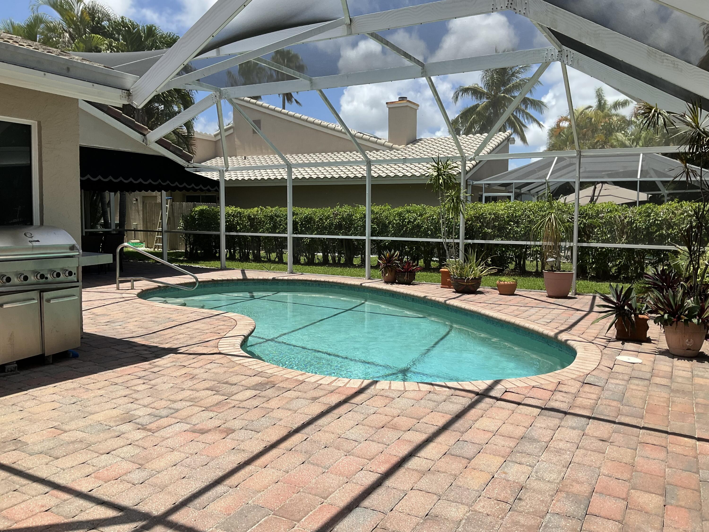 275 Northwest 69th Street Boca Raton, FL 33487 - Photo 7 of 34 BOCA LAKE ESTATE POOL BBQ AREA