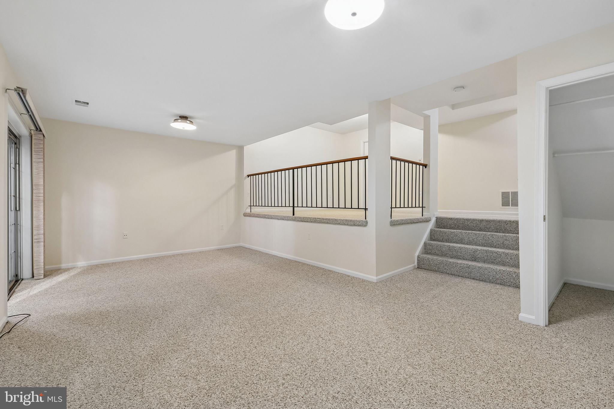 11714 Dry River Court Reston, VA 20191 - Photo 15 of 24 a view of an empty room with a staircase