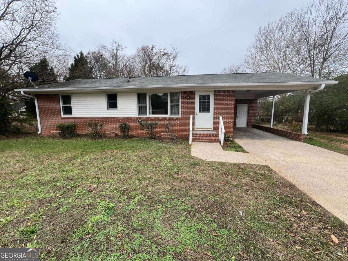 65 Sprayberry Road Newnan, GA 30263 - Photo 1 of 1 front view of a house with a yard