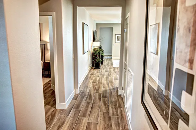 a kitchen with a table chairs and entryway