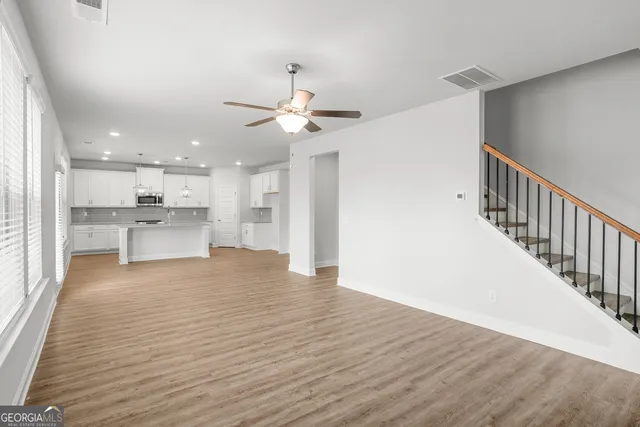 a view of kitchen with wooden floor and window