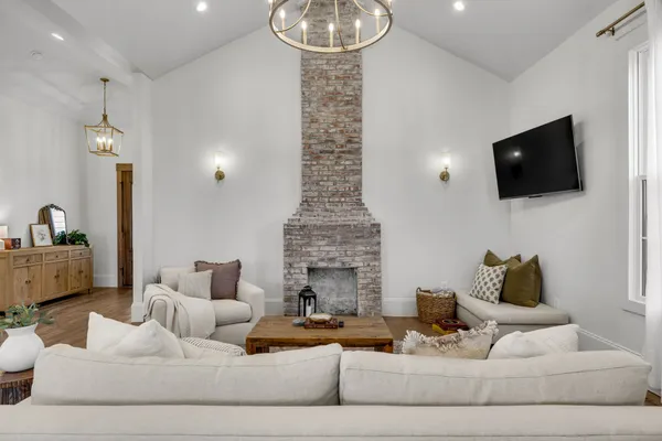 a living room with furniture and a fireplace