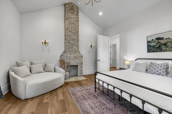 a bathroom with a double vanity sink mirror and toilet